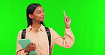 Green screen, happy girl or student pointing to decision for school choice or university choice on mockup. Face portrait, yes or pupil choosing or showing college education or info on studio space