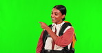 Hiking, smile and pointing with a woman on a green screen background in studio to explore information. Portrait, presentation or offer with a happy female hiker on a trip against chromakey mockup