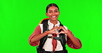 Hiking, heart and love with a woman on a green screen background in studio to explore for adventure. Emoji, health or hand gesture with a young female hiker looking happy on a trip against chromakey