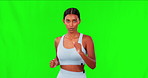 Woman, running and fitness on green screen in workout or cardio exercise against a studio background. Portrait of fit, active and sporty female person or runner in training for healthy body on mockup