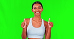 Happy woman, fitness and thumbs up on green screen for approval against a studio background. Portrait of fit, active and sporty female person with thumb emoji, yes sign or like for success on mockup