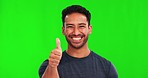 Thumbs up, face and happy man in green screen studio with hand, sign and thank you mockup background. Smile, portrait and asian male with yes finger emoji, vote or positive review, feedback or agree