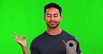 Asian man, yoga and meditation on green screen for mind, body and spirit against a studio background. Portrait of happy male person or yogi with smile and mat for zen meditating exercise on mockup