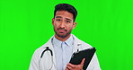 Healthcare, green screen and tablet with a doctor man on a studio background for bad news or diagnosis. Portrait, medical and negative with a sad young male medicine professional on chromakey mockup