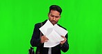 Businessman, walking and falling with papers on green screen in rush or clumsy against a studio background. Funny asian man employee with jumble paperwork, mistake and dropping documents on mockup