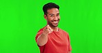 Man, green screen and face with point at you for choice, selection or recruitment with smile in mockup. Young person, excited student or happy for decision, hiring or volunteering in studio portrait