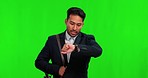 Green screen, business and man with an appointment, late and stress against a studio background. Male person, wristwatch and agent checking time, deadline and anxiety with alarm, walking and hurry