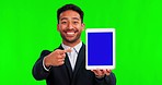 Business tablet, man pointing and green screen, mockup and online marketing, presentation or sign up offer. Happy face of asian person for digital tech space and ui or ux design on studio background