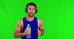 Face, green screen and Asian man running, headphones and fitness against a studio background. Portrait, male person and runner with headset, water bottle and training with workout goal and exercise