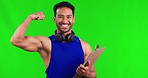Fitness, flex and man in a studio with green screen standing with a clipboard for workout plan. Sports, muscles and portrait of male personal trainer with checklist isolated by chroma key background.
