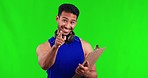 Happy asian man, clipboard and pointing to you on green screen for fitness signup against a studio background. Portrait of male person or gym instructor calling for register, document or paperwork
