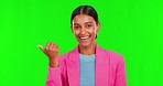 Face, green screen and Indian woman with promotion, pointing and presentation on a studio background. Portrait female person and model with hand, choice and deal with announcement with mockup space