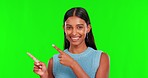 Green screen, happy woman and face advertising mockup space, decision and presentation of info in studio. Portrait, indian female model and pointing to review, promotion and marketing of announcement