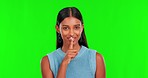 Green screen, face of woman and secret of finger on lips for privacy, mystery or noise in studio. Portrait of indian female model, silence and shush for gossip, whisper emoji or confidential surprise