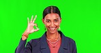 Okay hands, face and green screen of happy woman for good review, thank you and trust in studio. Portrait of indian female person, smile and ok of agreement, support or yes feedback for perfect emoji
