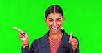 Woman pointing, thumbs up and green screen, presentation and thank you, support and yes, like or okay emoji. Face, happy and business indian person, OK hand or sign and show info on studio background
