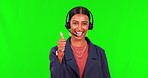 Business woman, call center and thumbs up on green screen with headphones against a studio background. Happy female person or consultant agent with headset, like emoji or yes sign in customer service