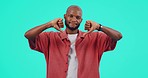 Thumbs down, face and hands of black man for no, dislike or rejection on mockup studio background. Portrait, feedback and emoji decision of a male person with a negative review, hand gesture and vote