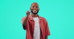 Motivation, pointing and choice with face of black man in studio for thank you, opportunity and yes. Decision, agreement and happy with portrait of person on blue background for selection and vote