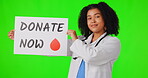 Green screen, woman or doctor with sign to donate now or healthcare isolated on studio background. Face portrait, help or medical worker with poster, blood drop words or announcement text for info 