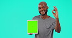 Okay sign, black man with tablet and against a blue background for advertising. Product placement or promotion, marketing or emoji hand and African male person pose for mockup space in a chroma key