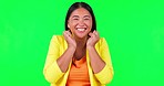 Green screen, wow and hands on woman face in studio with bonus, news or promotion, sale or discount on mockup background. Portrait, smile and excited asian lady winner celebrating coming soon deal