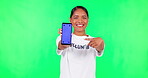Woman, point at smartphone mockup and green screen, volunteer for community service on app and ads. Female person in portrait, website marketing and UX, tech and tracking marker on studio background