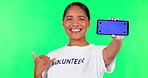 Phone, mockup and woman in a studio with green screen for marketing, promotion or advertising. Happy, smile and portrait of a female model with a call gesture and cellphone by a chroma key background