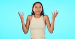 Confused, doubt and woman face in studio with emoji hands for decision, choice or puzzled on blue background. Questions, why and portrait of female person asking, dont know and shrug for option