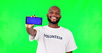 Black man, phone and mockup, green screen and volunteer, community service with app and ads on studio background. Website sign up, register for charity work and male person help and tracking marker