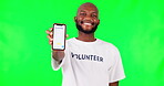 Black man, phone and social media, green screen and volunteer, community service with app and ads on studio background. Website sign up, register for charity work and male person help and nonprofit