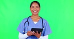 Face, woman and doctor with a tablet, green screen and internet connection on a studio background. Portrait, female person and medical professional with technology, typing and healthcare with a smile