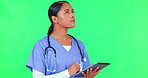 Doctor, woman and tablet on green screen in telehealth, healthcare service and hospital research or solution.  Thinking, ideas and medical worker, nurse or person on digital tech on studio background