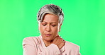Senior, business woman and neck pain, green screen and muscle tension with inflammation on studio background. Female professional, corporate burnout and spine injury, health problem and mockup space