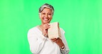 Happy, face and woman with a bag on a green screen for breakfast, lunch or food delivery. Smile, gift or portrait of a mature employee or manager with a present isolated on a mockup studio background