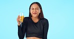 Happy, blue background and face of a woman with juice for health, diet or nutrition. Excited, vitamin c and portrait of a young girl with a healthy fruit drink isolated on a mockup studio background