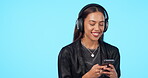 Headphone, streaming and indian girl with phone listening in blue studio with radio or app for entertainment. Podcast, listen and music with woman or technology for media on internet with message.
