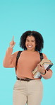 Pointing, information and portrait of student woman showing college or university option isolated in a studio blue background. Smile, happy and young female person with promo, deal or announcement