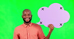 Speech bubble, space and a black man on green screen in studio for social media communication. Portrait, marketing or advertising and a male brand ambassador holding mock up with tracking markers