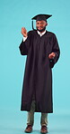 College student, pointing and graduation space in studio for future scholarship. Portrait, advertising and unsure black male show marketing for university choice, doubt or decision on blue background