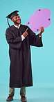 Black man, graduate and pointing at speech bubble for success, recruitment, blue background. Student, graduation and portrait with male person with promotion or announcement, sign up with happiness.