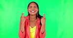Wish, woman with her fingers crossed for hope and against a green screen for competition. Giveaway or good luck, mockup space or praying and female person with emoji hand gesture for winning vote