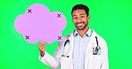 Asian man, doctor and speech bubble on green screen for chat on social media against a studio background. Portrait of male person, medical or healthcare professional smile for advertising on mockup