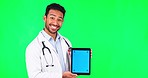 Asian man, doctor and tablet mockup on green screen for social media advertising against a studio background. Portrait of male person, medical or healthcare technology app display or tracking markers