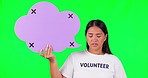 Speech bubble, green screen and volunteer fail by woman face in studio with tracking markers on mockup background.  Volunteering, crisis and portrait of asian lady with poster and bad feedback review