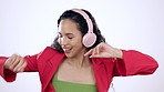 Dance, headphones and happy woman in studio with music, playlist or album for celebration or goal. Energy, smile and female model dancing to song to celebrate achievement isolated by white background