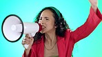 Megaphone, screaming and angry woman in studio with protest fist and speech for change, justice or vote on blue background. Bullhorn, noise and female speaker with transformation announcement or news