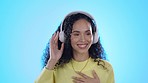 Music headphones, dance and woman smile in studio isolated on a blue background. Radio, listening and happy person streaming audio, album or sound track for jazz podcast, hip hop or rock with energy.