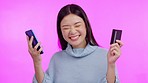 Asian woman, phone and credit card for online shopping in studio for retail deal, celebration and sale by background. Young Japanese girl, student and smartphone for fintech, e commerce and winning