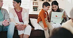 Family, children and a mom reading to her son in the living room of their home during a visit. Kids, book or child development with a parent and her boy bonding while storytelling in a house